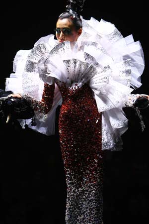 A model presents a creation at the 'Rosestudio' GUO Pei High Class Fashion Show 2010 during the China Fashion Week in Beijing, capital of China, Nov. 6, 2009. 