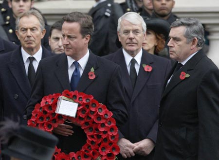 Britain's Prime Minister Gordon Brown (R) stands with former Prime Minister Tony Blair (L), the leader of the opposition Conservative Party David Cameron (2L) and former Prime Minister John Major as they attend the annual Remembrance Sunday ceremony at the Cenotaph in Whitehall, in central London November 8, 2009. [Xinhua/Reuters]