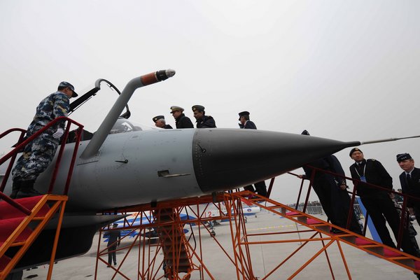 Homemade air force weapons are exhibited at the Beijing Shahe Military Airport to celebrate the 60th anniversary of the PLA air force. [CFP]