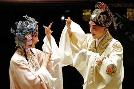 Photo taken on Nov. 7, 2009 shows a scene of 'Peony Pavilion', a well-known Chinese traditional Kunqu Opera, at the ancient stage of Sanshan Guildhall in Shanghai, east China. The Kunqu Opera 'Peony Pavilion' will be staged during the 2010 Shanghai World Expo for 120 times.(Xinhua/Guo Changyao)