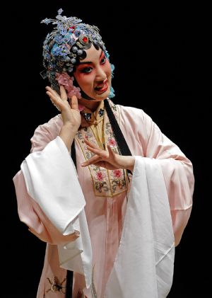 Photo taken on Nov. 7, 2009 shows a scene of 'Peony Pavilion', a well-known Chinese traditional Kunqu Opera, at the ancient stage of Sanshan Guildhall in Shanghai, east China.(Xinhua/Guo Changyao)