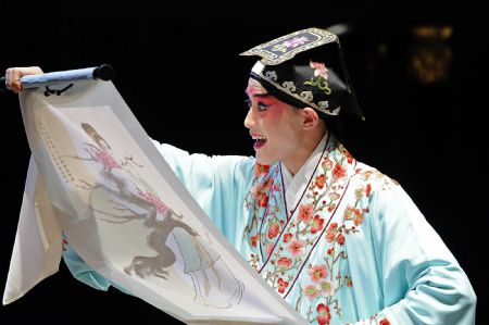 Photo taken on Nov. 7, 2009 shows a scene of 'Peony Pavilion', a well-known Chinese traditional Kunqu Opera, at the ancient stage of Sanshan Guildhall in Shanghai, east China.(Xinhua/Guo Changyao)