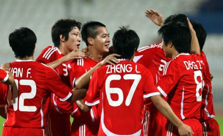  Players of China celebrate a goal during a friendly football match between China and Kuwait in Kuwait City Nov. 8, 2009.[Noufal Ibrahim/Xinhua]