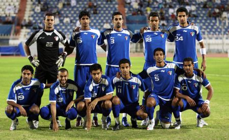 Kuwait's players pose for photos ahead of a friendly football match between China and Kuwait in Kuwait City Nov. 8, 2009. [Noufal Ibrahim/Xinhua]