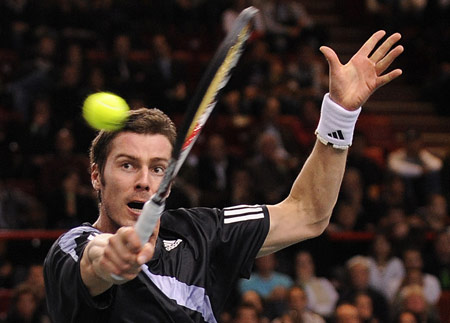 Marat Safin of Russia returns the ball to Thierry Ascione of France during the men's first round match in the Paris Masters Series tennis tournament, Nov. 9, 2009. Safin won the match 2-1. [Xinhua]