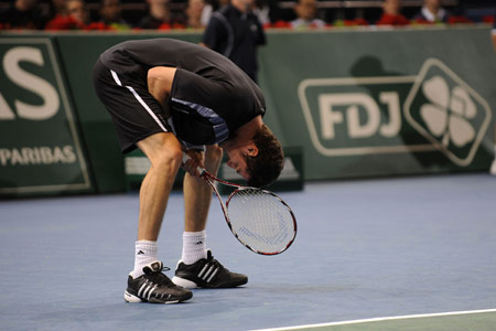 Marat Safin of Russia reacts during the men's first round match against Thierry Ascione of France in the Paris Masters Series tennis tournament, Nov. 9, 2009. Safin won the match 2-1. [Xinhua]