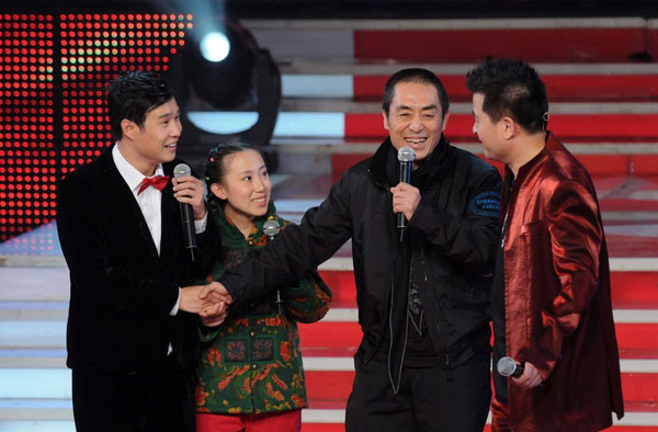 Chinese film director Zhang Yimou (second from right) promotes his new movie 'Amazing Tales: Three Guns' with cast members Xiao Shen Yang (left) and Mao Mao (second from the left) during a TV show hosted by Bi Fujian (right) in Beijing on November 10, 2009.