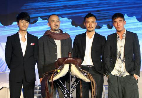 From left to right, cast members Chen Kun, Yao Lu, Liao Fan and Zhang Mo pose for a photo at a press conference for the movie 'Let the Bullets Fly' in Beijing on Tuesday, November 10, 2009. 