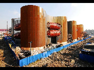 With the progress of construction, pavilions at Shanghai 2010 World Expo in various shapes are unveiled in succession. It is reported that the whole park will be basically completed at the end of this year.[sina.com.cn]