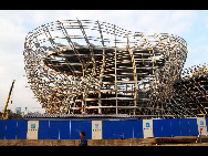 With the progress of construction, pavilions at Shanghai 2010 World Expo in various shapes are unveiled in succession. It is reported that the whole park will be basically completed at the end of this year.[sina.com.cn]