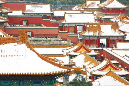 The snow-capped roofs give the Forbidden City in Beijing an unusual look. 