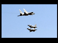 Four J-10 fighter planes perform during an air force show in Beijing, November 15, 2009. The show was staged to celebrate the 60th anniversary of the founding of People's Liberation Army (PLA) Air Force. [Xinhua]