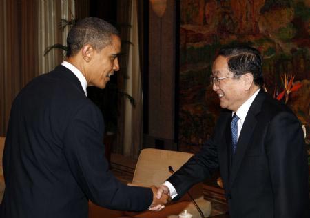 U.S. President Barack Obama(L) meets with Yu Zhengsheng, member of the Political Bureau of the Communist Party of China (CPC) Central Committee and secretary of the CPC Shanghai Municipal Committee, at the Xijiao State Guest House in Shanghai, Nov. 16, 2009. [Zhang Ming/Xinhua]