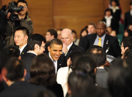 U.S. President Barack Obama talks with Chinese students after delivering a speech at a dialogue with Chinese youths at the Shanghai Science and Technology Museum during his four-day state visit to China, Nov. 16, 2009.(Xinhua/Pei Xin)