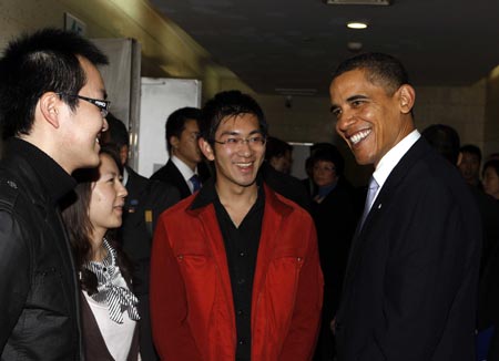 U.S. President Barack Obama talks with Chinese students before delivering a speech at a dialogue with Chinese youth at the Shanghai Science and Technology Museum during his four-day state visit to China, Nov. 16, 2009.