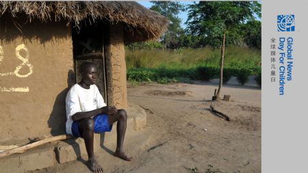 Denis Opoka sits in front of his hut at Ajulu village, in Gulu district, northern Uganda, on Oct. 20, 2009. [Tian Ye/Xinhua] 