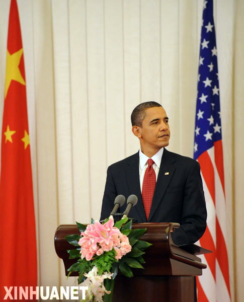  Visiting U.S. President Barack Obama reacts during a press conference held with Chinese President Hu Jintao following their official talks at the Great Hall of the People in Beijing on Nov. 17, 2009. [Liu Jiansheng/Xinhua]