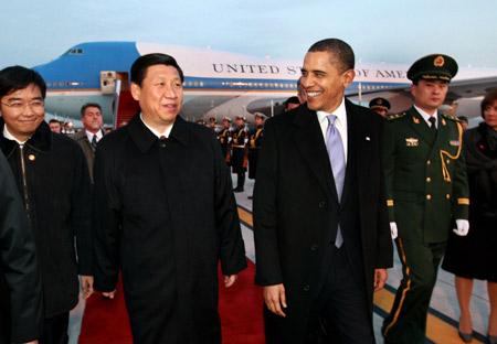 Chinese Vice President Xi Jinping walks with U.S. President Barack Obama at the airport in Beijing, capital of China, on Nov. 16, 2009. Obama arrived here Monday afternoon to continue his four-day state visit to China. [Xinhua] 