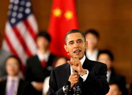 U.S. President Barack Obama gestures as he delivers a speech at a dialogue with Chinese youths at the Shanghai Science and Technology Museum during his four-day state visit to China, Nov. 16, 2009.(Xinhua/Chen Fei)