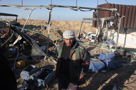 A Palestinian man inspects damages of underground tunnels on Gaza&apos;s southern border with Egypt following Israeli airstrikes Nov. 19, 2009. Israeli jets attacked on Thursday morning a building and two tunnels, wounding three people in southern Gaza Strip in response to Palestinian rocket-fire on Israeli territories.[Xinhua]