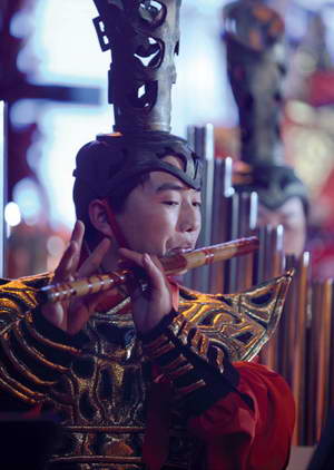 A Chou Rituals Orchestra musician playing the flute.