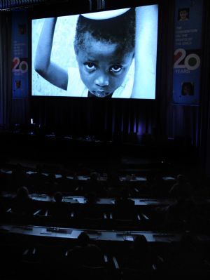 A documentary video about the state of children across the globe is projected during the ceremony marking the Universal Children's Day and the 20th anniversary of the Convention on the Rights of the Child at the UN headquarters in New York Nov. 20, 2009. The UN General Assembly on Nov. 20. 1989 adopted the Convention on the Rights of the Child for signature. It became the first legally binding international convention to affirm human rights for all children. [Shen Hong/Xinhua]