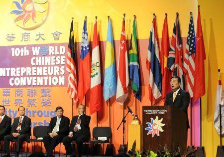 Huang Mengfu (R1), vice chairman of the National Committee of the Chinese People's Political Consultative Conference, addresses the opening ceremony of the 10th World Chinese Entrepreneurs Convention (WCEC) in Manila, capital of the Philippines, on Nov. 20, 2009. [Fan Rujun/Xinhua]