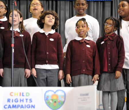 Children choir from Thomas Elementary School perform during the celebration marking the Universal Children's Day and the 20th anniversary of the Convention on the Rights of the Child, at Washington Convention Center in Washington, D.C., capital of the U.S., Nov, 20, 2009