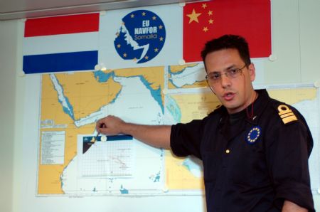 An officer of the European Union (EU) navy 465 formation introduces to Wang Zhiguo (unseen in the photo), commander of the Chinese naval 3rd escort fleet, during Wang