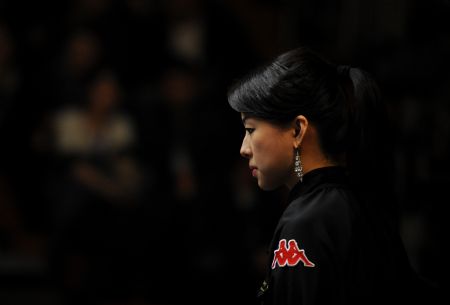 Pan Xiaoting of China reacts during the third-place match against her compatriot Fu Xiaofang at the 2009 Women's 9-Ball World Championship in Shenyang, northeast China's Liaoning Province, Nov. 22, 2009. Pan won 9-1. (Xinhua/Li Gang)