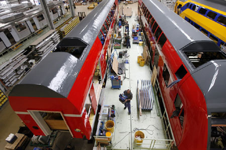 Deutsche Bahn regional trains sit on the production line at a Bombardier train factory in Goerlitz, Germany. Bombardier is seeking to win new orders for its rail and aviation products in China.