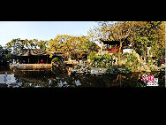 Tongli is an ancient water town in east China's Jiangsu Province. A short drive from Suzhou, Tongli offers a step back in time. Crisscrossed by rivers and canals. Tongli enjoys fame across China for its beautiful rivers, historic bridges and opulent court yard homes. Tongli has 49 stone bridges and many gardens, temples. Because of the landscape, almost all of the buildings are constructed along the waterfront. [Photo by Liu Guoxing]