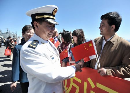 Rear Admiral Wang Fushan (L front), deputy commander of the Chinese Navy North Sea Fleet, is welcomed as Chinese fleet arrives at the harbor in Valparaiso, Chile, Nov. 23, 2009. The Chinese People
