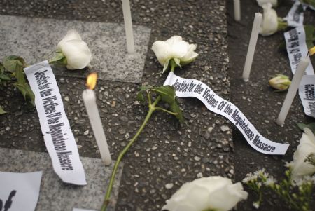 Candles are seen during a rally held by the students to mourn over the victims of the massacre, in Manila, capital of the Philippines, Nov. 24 2009. Philippine President Gloria Macapagal-Arroyo on Nov. 24 placed three provinces in southern Mindanao region under the state of emergency following Monday's bloody political massacre that left at least 36 people killed.(Xinhua/Jon Fabrigar)