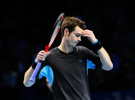 Andy Murray of Britain reacts during his Group A match against Roger Federer of Switerland at ATP World Tour Finals in London, capital of Britain, Nov. 24, 2009. Murray lost 1-2. (Xinhua/Zeng Yi)