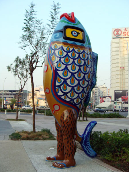 A fish-man statue stands in front of the Sogo shopping mall. [Photo: CRIENGLISH.com]