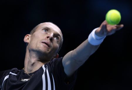 Nikolay Davydenko of Russia serves to Rafael Nadal of Spain during their ATP World Tour Finals tennis match in London, November 25, 2009.