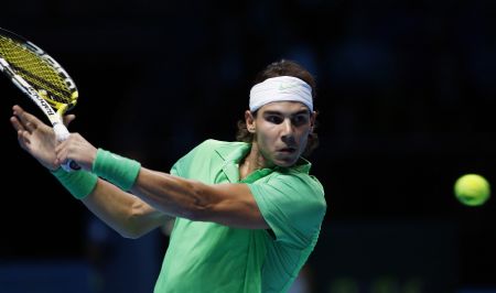 Rafael Nadal of Spain returns the ball to Nikolay Davydenko of Russia during their ATP World Tour Finals tennis match in London November 25, 2009. 