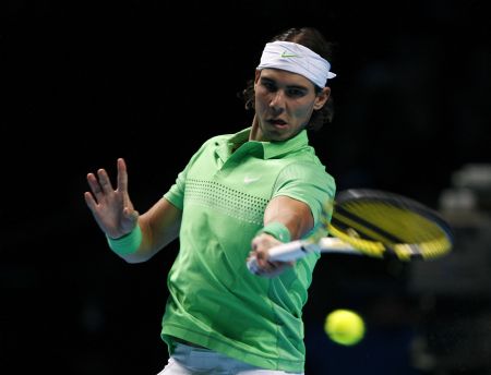 Rafael Nadal of Spain returns the ball to Nikolay Davydenko of Russia during their ATP World Tour Finals tennis match in London, November 25, 2009.