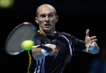 Nikolay Davydenko of Russia returns the ball to Rafael Nadal of Spain during their ATP World Tour Finals tennis match in London, November 25, 2009.