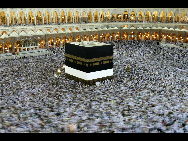 Muslim pilgrims pray around the Kaaba inside the Grand Mosque in the holy city of Mecca during morning prayers before the start of this year's haj pilgrimage Nov. 24, 2009.More than two million Muslims gather this week for the annual haj pilgrimage to Islam's holy city of Mecca. The haj is one of the world's biggest displays of mass religious devotion and a duty for Muslims who can perform it.[Xinhua]