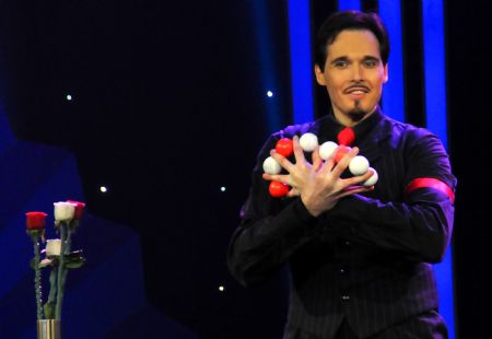 A Canadian magician performs at a magic competition held in Guannan County of east China&apos;s Jiangsu Province, Nov. 26, 2009. Forty-one magicians from 6 Asian countries and regions took part in the magic competition started on Thursday. Winners will be announced on Saturday. [Jiang Fan/Xinhua]