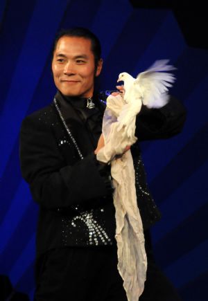 Wang Xiaolong, a Chinese magician performs at a magic competition held in Guannan County of east China&apos;s Jiangsu Province, Nov. 26, 2009. Forty-one magicians from 6 Asian countries and regions took part in the magic competition started on Thursday. Winners will be announced on Saturday. [Jiang Fan/Xinhua]