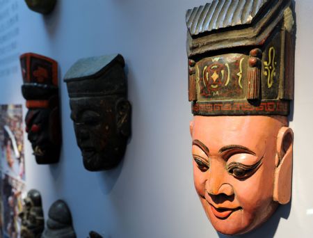 Photo taken on Nov. 27, 2009 shows the Dixi Opera masks at the Chinese Intangible Cultural Heritage Show held in Taipei, Taiwan.