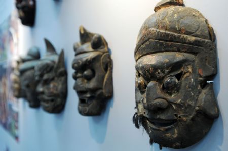 Photo taken on Nov. 27, 2009 shows the Dixi Opera masks at the Chinese Intangible Cultural Heritage Show held in Taipei, Taiwan.