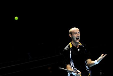 Nikolay Davydenko of Russia celebrates during the ATP World Tour Finals Group B Singles third round match against Robin Soderling of Sweden in London, capital of Britain, Nov. 27, 2009. Davydenko won 2-1.