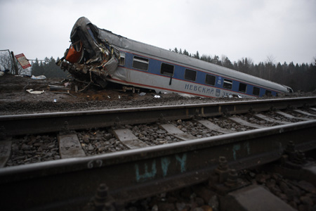 Russian intelligence officers said Saturday that the derailment of a luxury train that killed at least 26 people and injured dozens more was caused by a bomb blast.