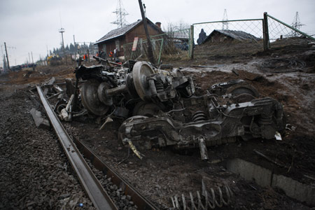 Russian intelligence officers said Saturday that the derailment of a luxury train that killed at least 26 people and injured dozens more was caused by a bomb blast.