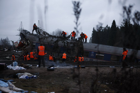 Russian intelligence officers said Saturday that the derailment of a luxury train that killed at least 26 people and injured dozens more was caused by a bomb blast.