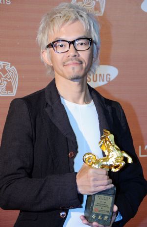 Lee Tian-jue holds the award for Best Art Direction for the film 